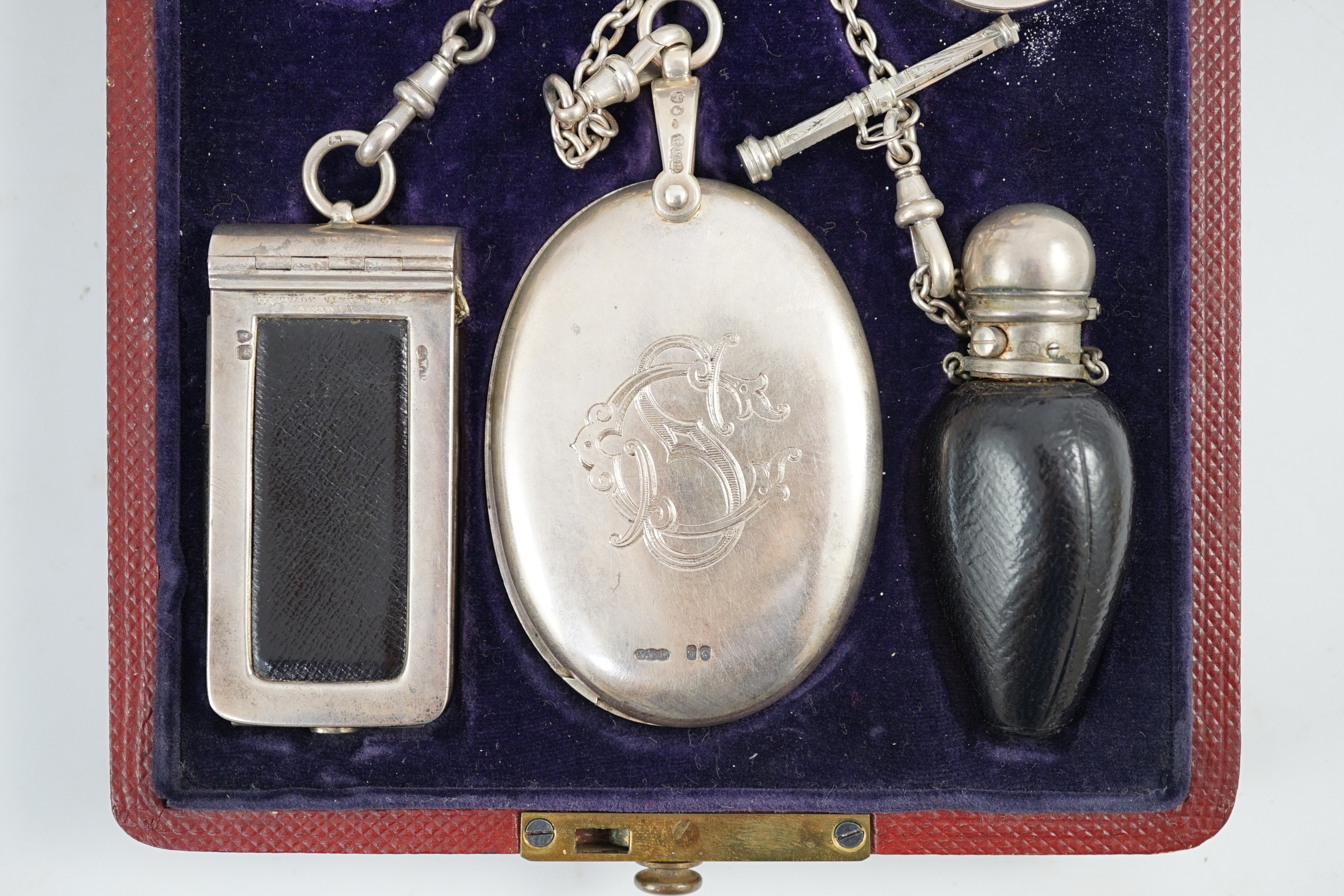 A cased Victorian silver chatelaine by Henry William Dee, London, 1874